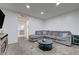 Comfortable living room featuring a large gray sectional and contemporary decor at 7066 Burcot Ave # 59, Las Vegas, NV 89156
