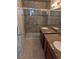 Bathroom features tile flooring, double sink vanity, and a large shower at 7426 Trudy Ln, Las Vegas, NV 89123