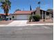 Charming single-story home with a red tile roof and a well-maintained front yard at 7426 Trudy Ln, Las Vegas, NV 89123