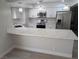 Modern kitchen with white cabinets, stainless steel appliances, and quartz countertops at 7426 Trudy Ln, Las Vegas, NV 89123