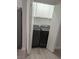 Laundry room with gray, front-loading washer and dryer at 7426 Trudy Ln, Las Vegas, NV 89123