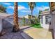 Low-maintenance backyard with patio, perfect for outdoor living, features tasteful desert landscaping at 7701 Sea Cliff Way, Las Vegas, NV 89128