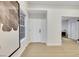 Bright entry foyer with light wood floors and white walls, showcasing a modern aesthetic at 7701 Sea Cliff Way, Las Vegas, NV 89128