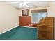 Bedroom with a wooden baby changing table, carpet, and a window with blinds at 8620 Copper Mountain Ave, Las Vegas, NV 89129
