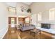 Spacious living room with hardwood floors, a fireplace, and vaulted ceilings at 8620 Copper Mountain Ave, Las Vegas, NV 89129