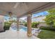 Covered patio area overlooking sparkling pool and lush greenery for outdoor enjoyment at 8620 Copper Mountain Ave, Las Vegas, NV 89129