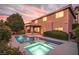 Beautiful backyard pool and spa with landscaped yard and covered patio at 8620 Copper Mountain Ave, Las Vegas, NV 89129