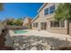 Spacious backyard featuring a pool, patio, and manicured landscaping, perfect for entertaining at 9308 Pitching Wedge Dr, Las Vegas, NV 89134