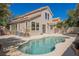 Backyard view featuring a private pool and patio area perfect for outdoor entertaining at 9308 Pitching Wedge Dr, Las Vegas, NV 89134