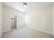 Clean and bright bedroom with neutral carpet, a window, and a closet at 9308 Pitching Wedge Dr, Las Vegas, NV 89134
