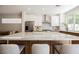Bright kitchen features a spacious island with marble countertop, stainless appliances, and stylish cabinetry at 9308 Pitching Wedge Dr, Las Vegas, NV 89134