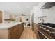 Open concept kitchen features stainless appliances and seamlessly connects to the living and dining areas at 9308 Pitching Wedge Dr, Las Vegas, NV 89134