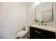 Stylish powder room features modern vanity, gold hardware, and contemporary mirror at 9308 Pitching Wedge Dr, Las Vegas, NV 89134