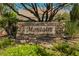 Stone sign with the 'Montaire' neighborhood name. Includes green foliage and manicured landscaping in a welcoming entry at 9308 Pitching Wedge Dr, Las Vegas, NV 89134