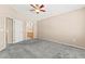 Spacious bedroom featuring soft carpet, neutral walls, and an open doorway to the bathroom at 9338 Square Dance Pl # 101, Las Vegas, NV 89178
