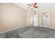 Bedroom with neutral walls, soft carpet, and a view into an attached bathroom at 9338 Square Dance Pl # 101, Las Vegas, NV 89178