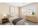 Inviting bedroom featuring a large window, neutral walls and a plush carpet at 9338 Square Dance Pl # 101, Las Vegas, NV 89178