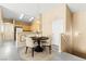 Dining area with a round table, four chairs, and a pendant light fixture at 9338 Square Dance Pl # 101, Las Vegas, NV 89178