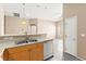 Open dining area with modern gray flooring, and convenient access to the kitchen at 9338 Square Dance Pl # 101, Las Vegas, NV 89178