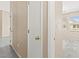 Hallway featuring neutral walls, wood floors, and an entrance into a bedroom at 9338 Square Dance Pl # 101, Las Vegas, NV 89178