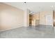 Spacious living room with open floor plan, neutral tones, and modern flooring at 9338 Square Dance Pl # 101, Las Vegas, NV 89178