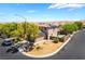 Aerial view of the home featuring solar panels, desert landscaping, and privacy wall at 9373 Wild Lariat Ave, Las Vegas, NV 89178