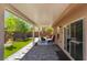 Charming backyard with a covered patio, artificial grass, and brick paver flooring at 9373 Wild Lariat Ave, Las Vegas, NV 89178