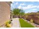 Backyard features artificial grass, brick pavers, and gravel landscaping at 9373 Wild Lariat Ave, Las Vegas, NV 89178
