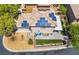 Aerial view of home with solar panels, paver patio, artificial grass, and desert landscaping at 9373 Wild Lariat Ave, Las Vegas, NV 89178