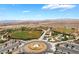 Aerial view of baseball field with sports facilities, parking area, and mountains at 9373 Wild Lariat Ave, Las Vegas, NV 89178