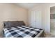 This bedroom has carpet and a door that leads to another room at 9373 Wild Lariat Ave, Las Vegas, NV 89178