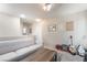 A spacious bedroom features a sofa and guitars at 9373 Wild Lariat Ave, Las Vegas, NV 89178