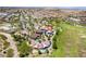 Aerial view of a park featuring picnic structures, green spaces, and walking paths in a vibrant community at 9373 Wild Lariat Ave, Las Vegas, NV 89178