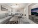 Inviting living area with comfortable seating, modern decor, and a mounted television at 9373 Wild Lariat Ave, Las Vegas, NV 89178