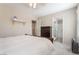 A comfortable bedroom with a wooden bed, dresser and a bathroom at 9373 Wild Lariat Ave, Las Vegas, NV 89178