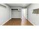 Empty bedroom with hardwood floors, closet space, and neutral walls ready for personalization at 9572 Belle Rich St, Las Vegas, NV 89123