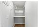 Functional closet featuring built in shelving and white walls at 9572 Belle Rich St, Las Vegas, NV 89123