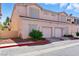 Charming townhome with a two car garage, lush landscaping, and a tile roof at 9572 Belle Rich St, Las Vegas, NV 89123