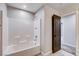 Clean bathroom showcasing a tub-shower with white tiling, great for relaxation and convenience at 10556 Sariah Skye Ave, Las Vegas, NV 89166