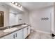 Functional bathroom featuring dual sinks, granite counters, a toilet, and a shower/tub combo at 10556 Sariah Skye Ave, Las Vegas, NV 89166