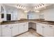 Bright bathroom features dual sinks, granite countertops, and large mirrors for a luxurious feel at 10556 Sariah Skye Ave, Las Vegas, NV 89166