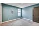 Cozy bedroom with soft carpeting, a window, and a TV mount for easy setup at 10556 Sariah Skye Ave, Las Vegas, NV 89166