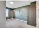 Bedroom featuring a bracket for a flatscreen TV, carpet and green walls at 10556 Sariah Skye Ave, Las Vegas, NV 89166