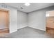 This bedroom features neutral carpet and paint, an overhead light and two doors at 10556 Sariah Skye Ave, Las Vegas, NV 89166