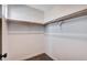 This closet features grey carpet, white walls, two rows of shelves and a window at 10556 Sariah Skye Ave, Las Vegas, NV 89166