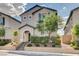 Charming home featuring a landscaped yard, attractive facade with blue shutters, and welcoming entrance at 10556 Sariah Skye Ave, Las Vegas, NV 89166