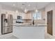 Modern kitchen featuring stainless steel appliances, granite countertops and a large center island at 10556 Sariah Skye Ave, Las Vegas, NV 89166