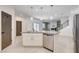 Modern kitchen features an island with granite countertops, stainless steel appliances, and pendant lighting at 10556 Sariah Skye Ave, Las Vegas, NV 89166