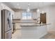 Well-appointed kitchen with a center island, stainless steel appliances, and modern pendant lighting at 10556 Sariah Skye Ave, Las Vegas, NV 89166