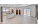 Open floorplan featuring a kitchen with island and ample counterspace, plus sliding door to patio at 10556 Sariah Skye Ave, Las Vegas, NV 89166